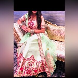 Lotus Embroidered Lehenga skirt Choli in pista Green and peach combination